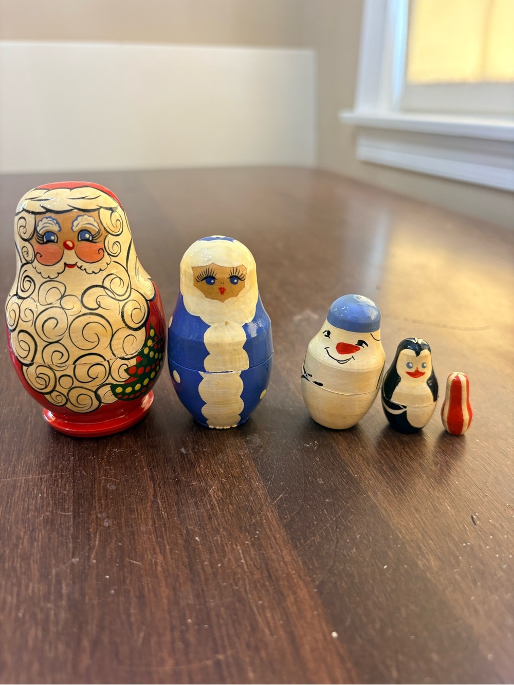 Charming hand-painted wooden Christmas nesting dolls